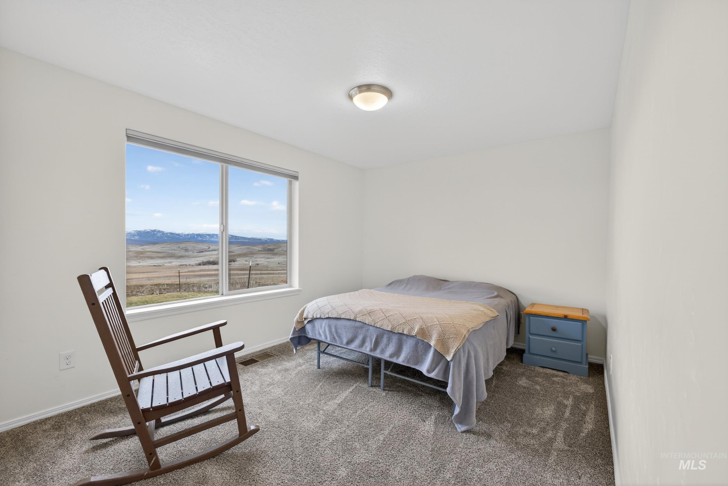 1854 Jacks Road Midvale, ID 83645 - Photo 8 of 16 Carpeted bedroom featuring a mountain view and baseboards