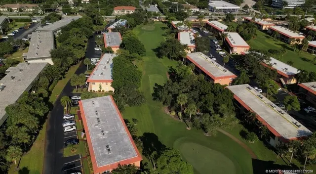 an aerial view of a house with a garden