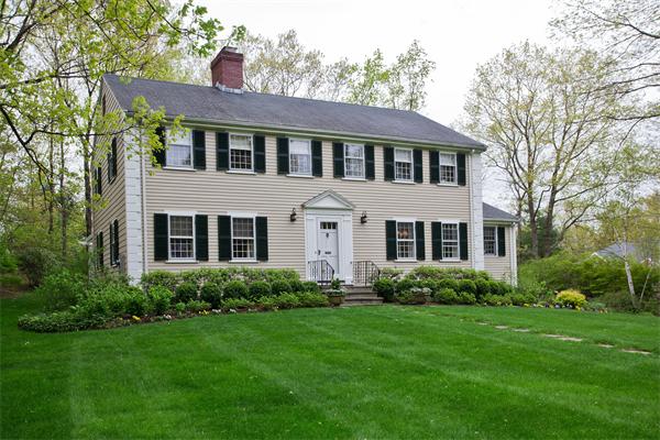 46 Yarmouth Road Wellesley, MA 02481 - Photo 1 of 11 a front view of a house with a garden