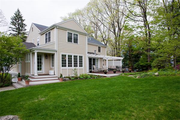 46 Yarmouth Road Wellesley, MA 02481 - Photo 3 of 11 a view of a house with a yard and sitting area