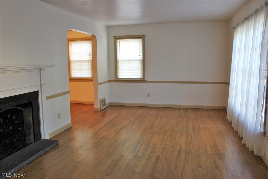 1184 Gordon Road Lyndhurst, OH 44124 - Photo 7 of 22 Large picture window and chair railing accent the Living Room.