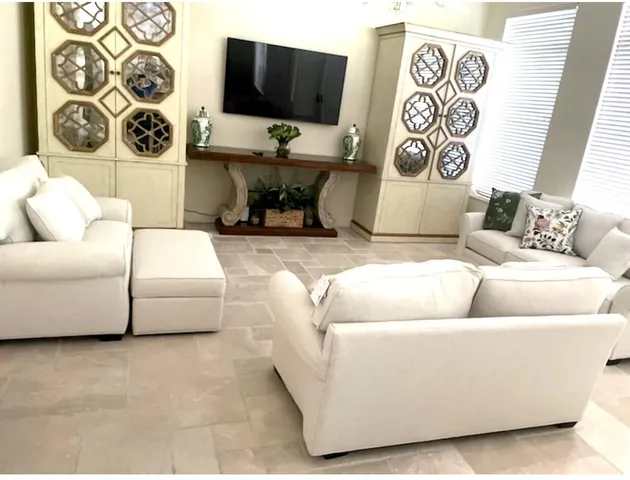 a living room with a couch and a flat screen tv