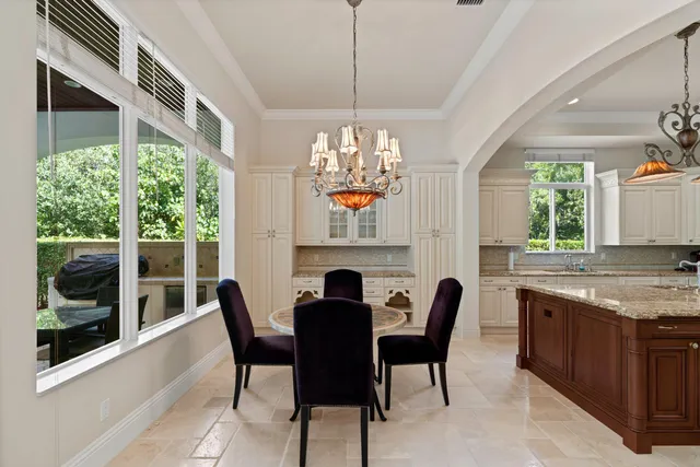 a view of a dining room with furniture window and outside view