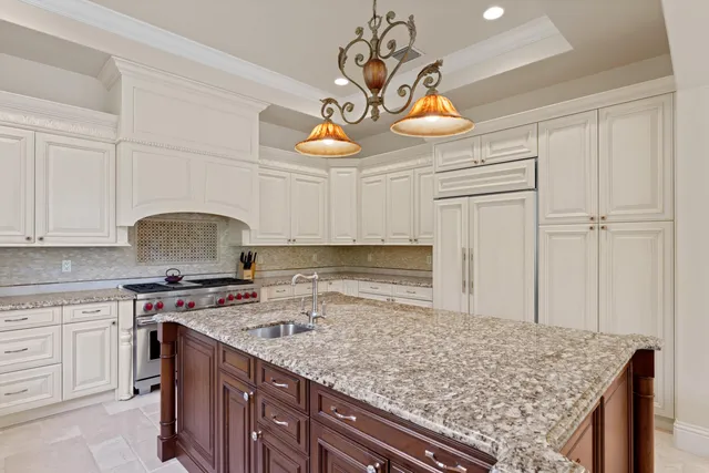 a kitchen with a stove and cabinets