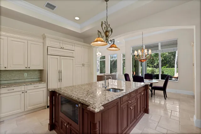a open kitchen with a table and chairs in it