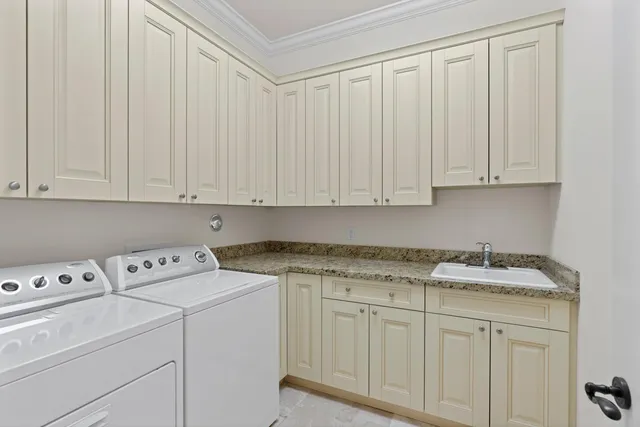 a view of cabinets with washer dryer