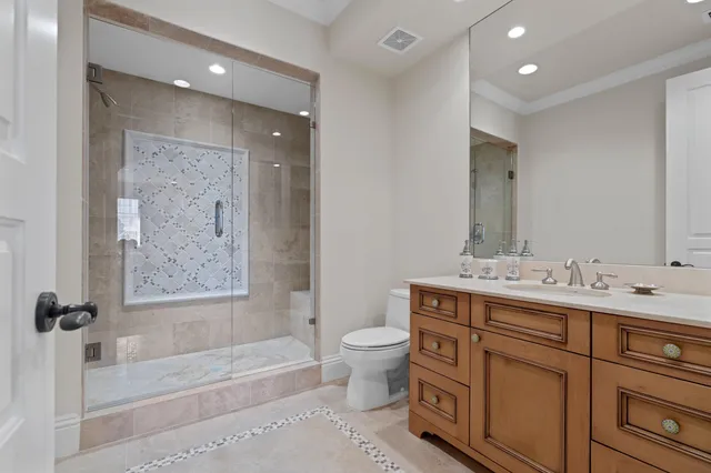 a bathroom with a double vanity sink toilet mirror and bathtub