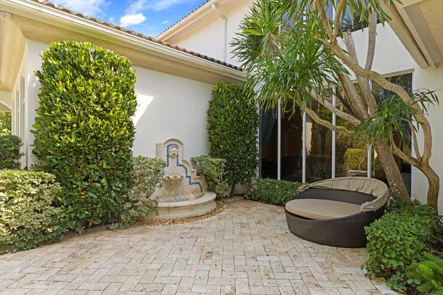 a view of a chair and table in backyard