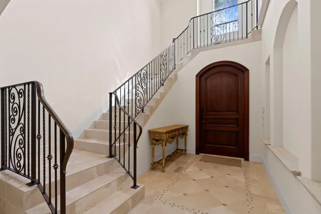 a view of entryway with wooden stairs