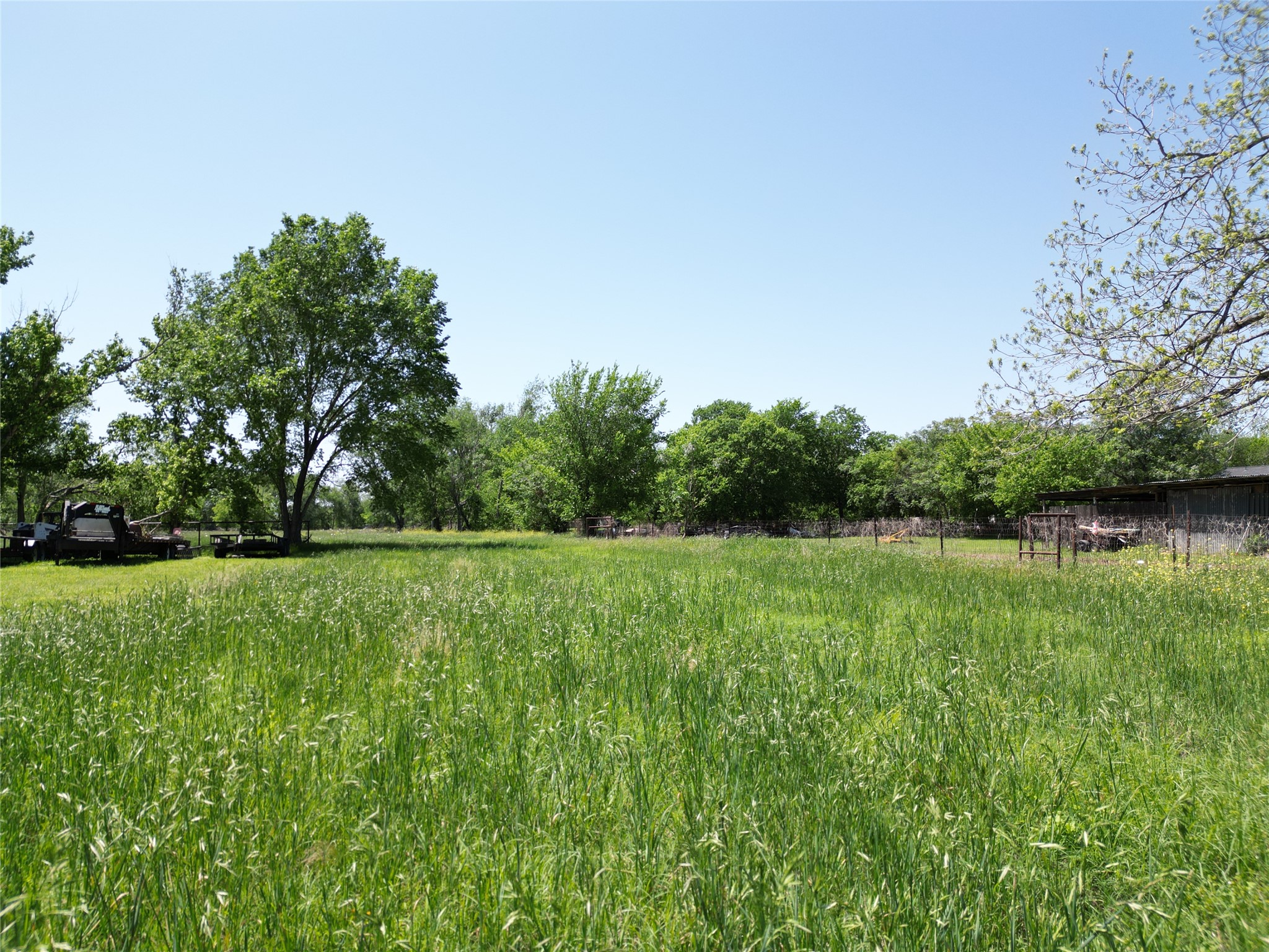 Tbd Blanco Avenue Luling, TX 78648 - Photo 7 of 10 a big yard with lots of green space and trampoline