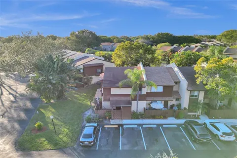 an aerial view of a house with a garden space