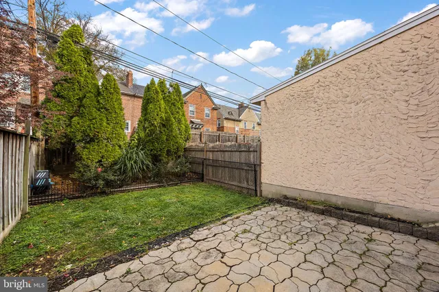 a view of a brick house with a yard