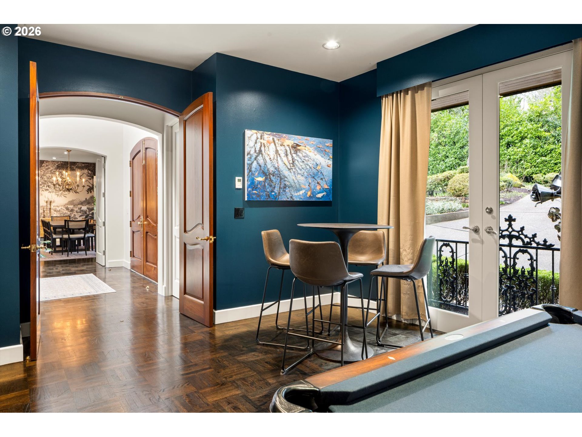1616 South Greenwood Road Portland, OR 97219 - Photo 11 of 48 a dining room with wooden floor and a floor to ceiling window