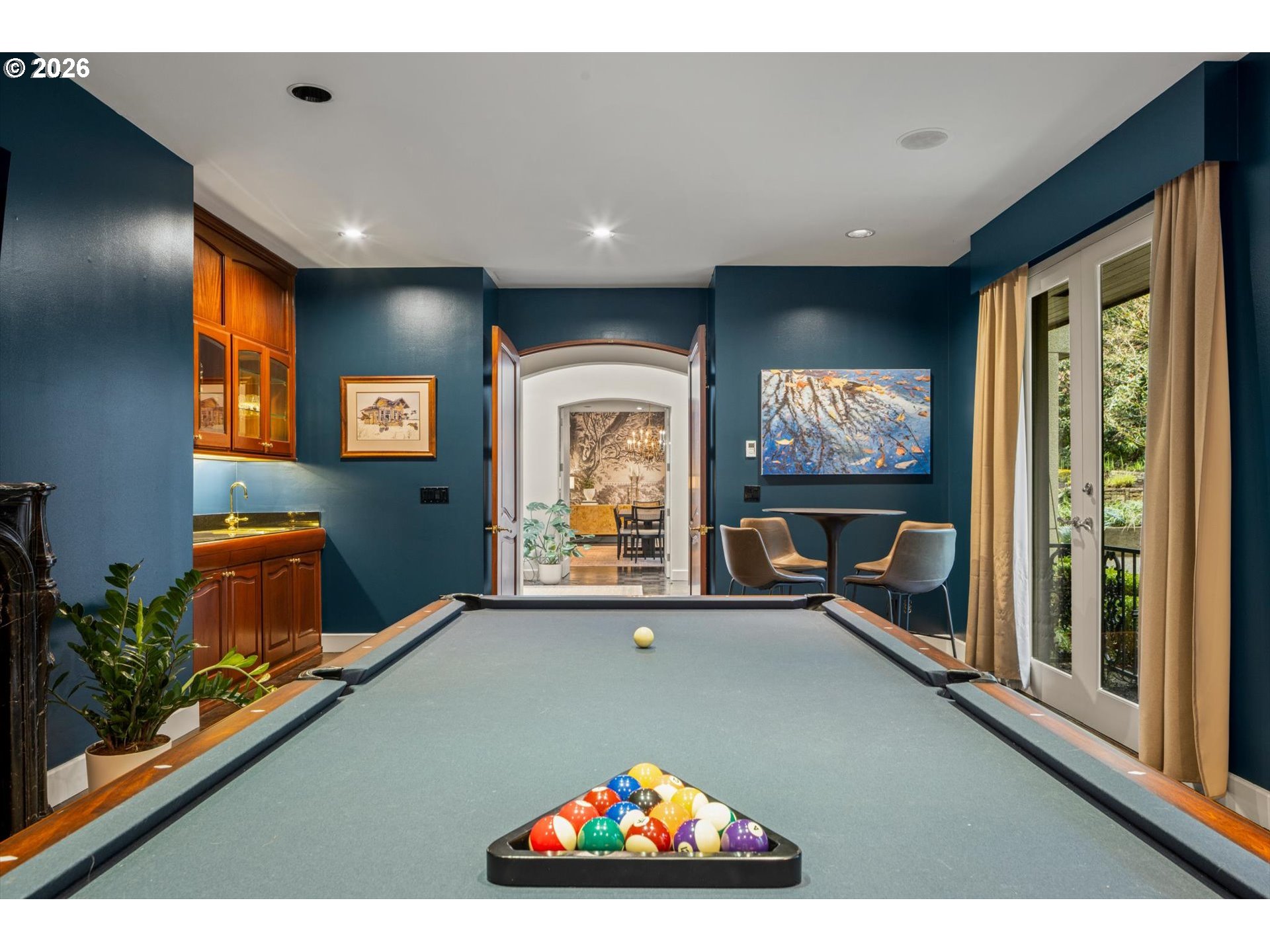 1616 South Greenwood Road Portland, OR 97219 - Photo 12 of 48 a living room with furniture pool table and a flat screen tv