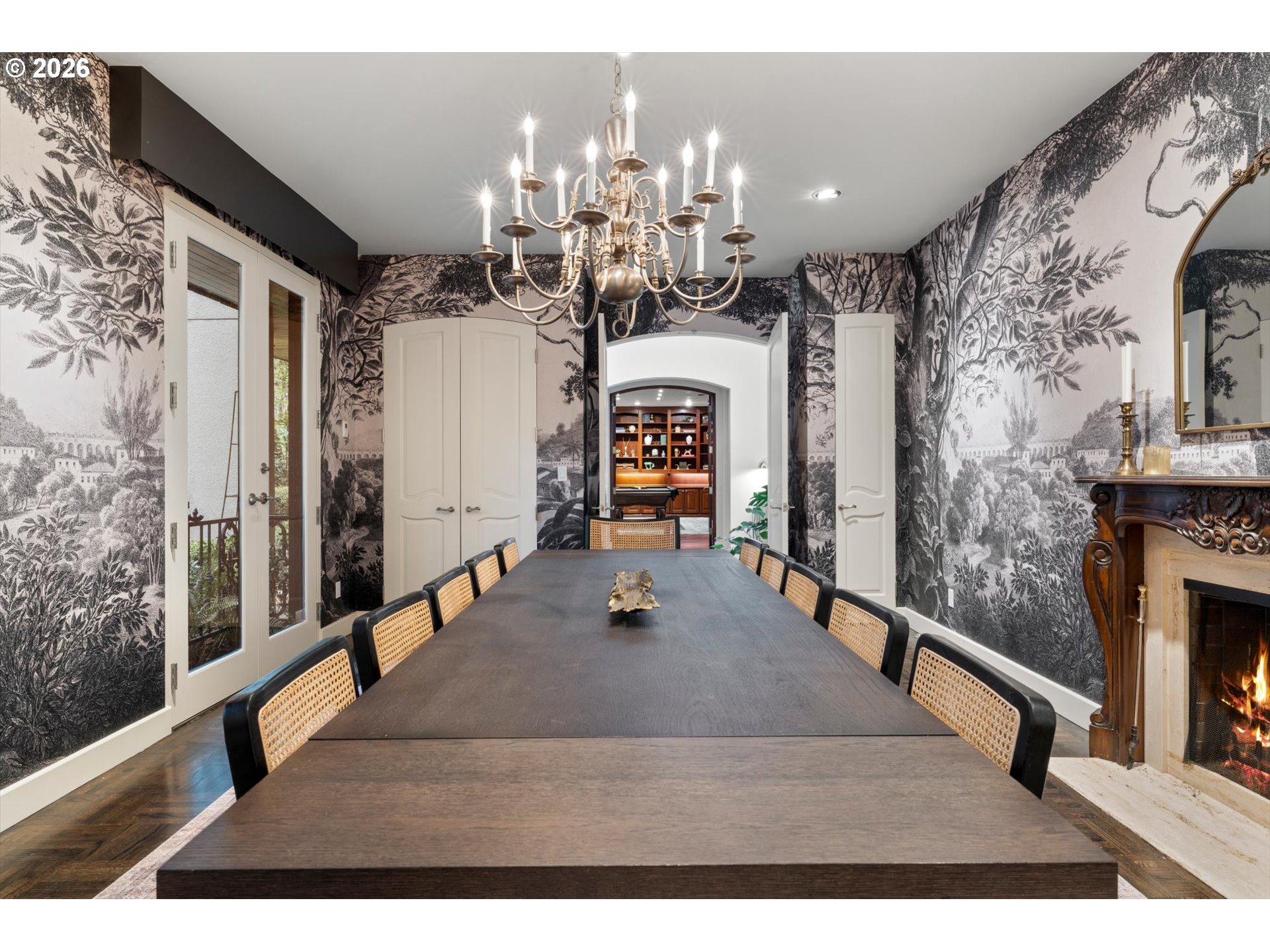 1616 South Greenwood Road Portland, OR 97219 - Photo 16 of 48 a view of a living room and chandelier with wooden floor