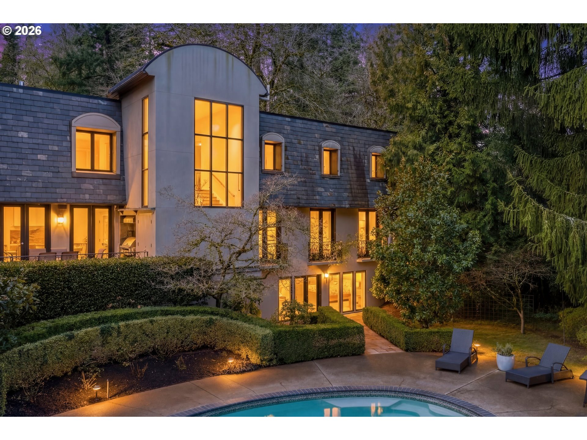 1616 South Greenwood Road Portland, OR 97219 - Photo 2 of 48 a front view of a house with garden