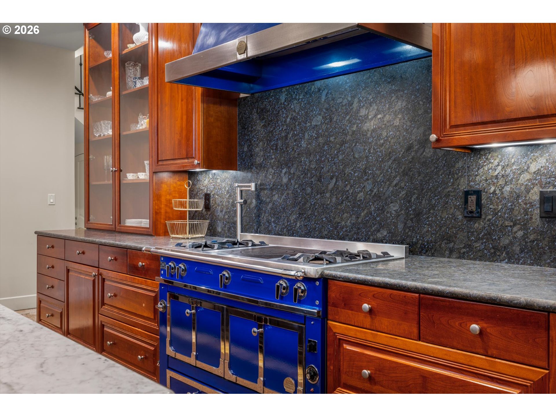 1616 South Greenwood Road Portland, OR 97219 - Photo 25 of 48 a kitchen with stainless steel appliances granite countertop wooden cabinets and a granite counter tops