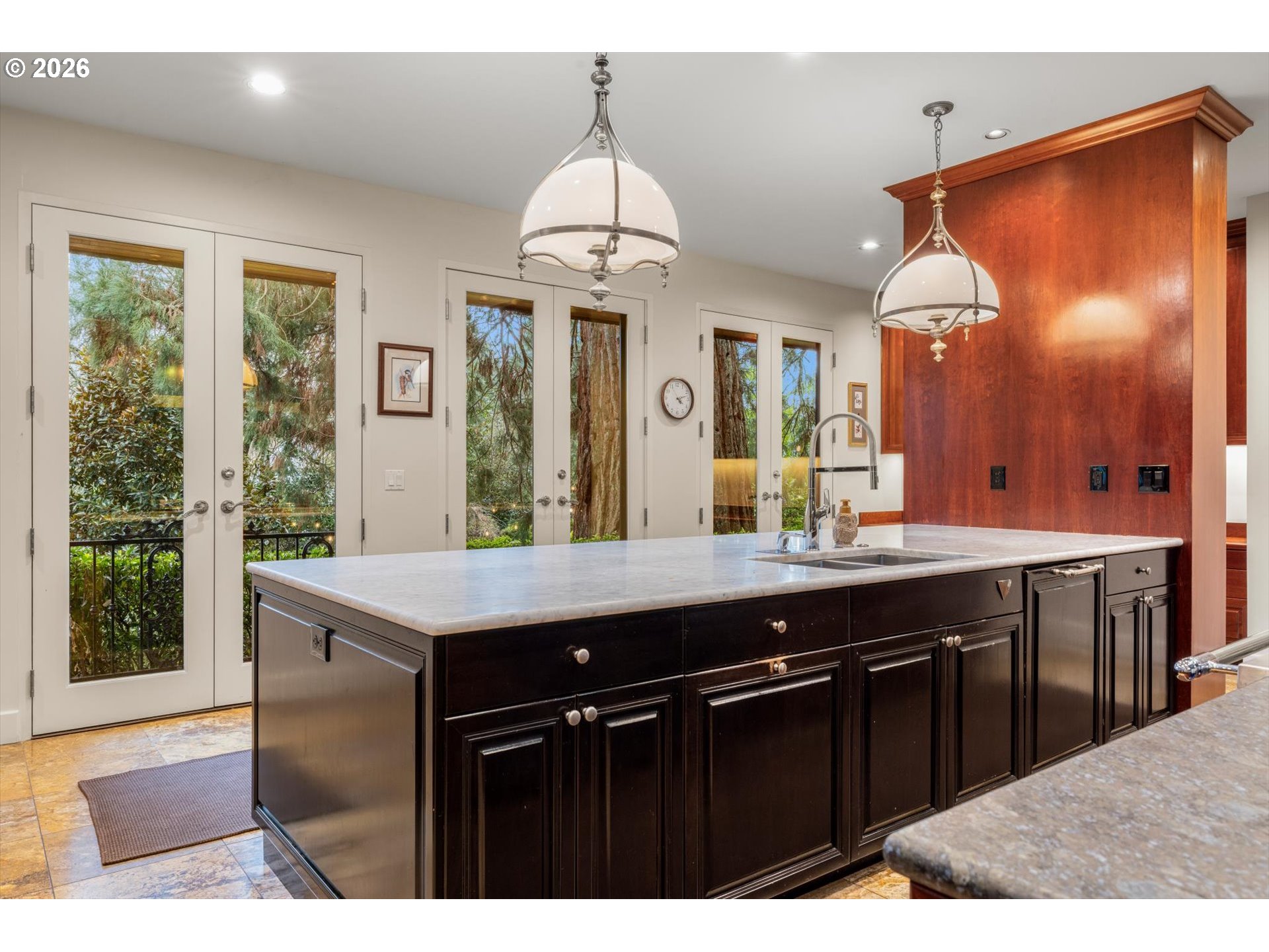 1616 South Greenwood Road Portland, OR 97219 - Photo 27 of 48 a kitchen with a counter space dining table and a sink