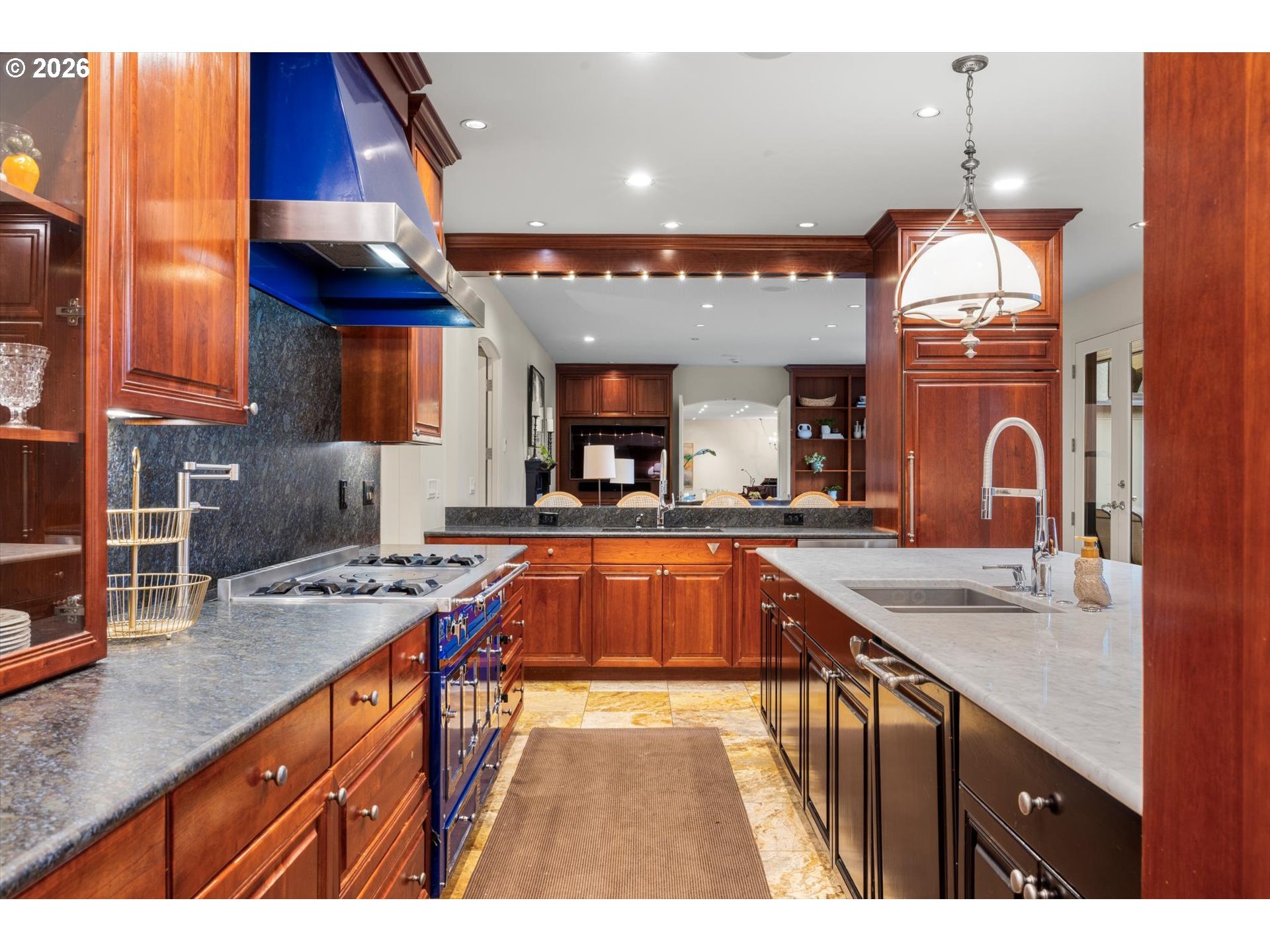 1616 South Greenwood Road Portland, OR 97219 - Photo 28 of 48 a kitchen with stainless steel appliances granite countertop a sink a stove and a wooden cabinets