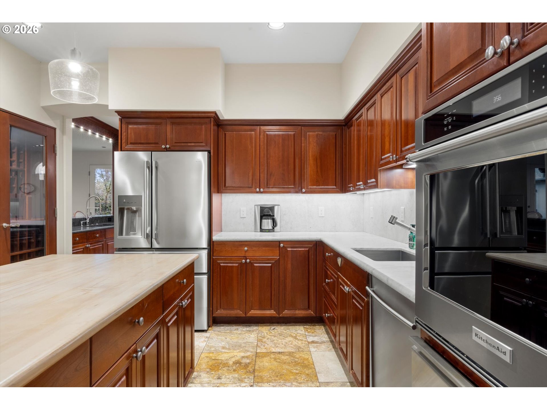 1616 South Greenwood Road Portland, OR 97219 - Photo 29 of 48 a kitchen with stainless steel appliances granite countertop a refrigerator and a sink