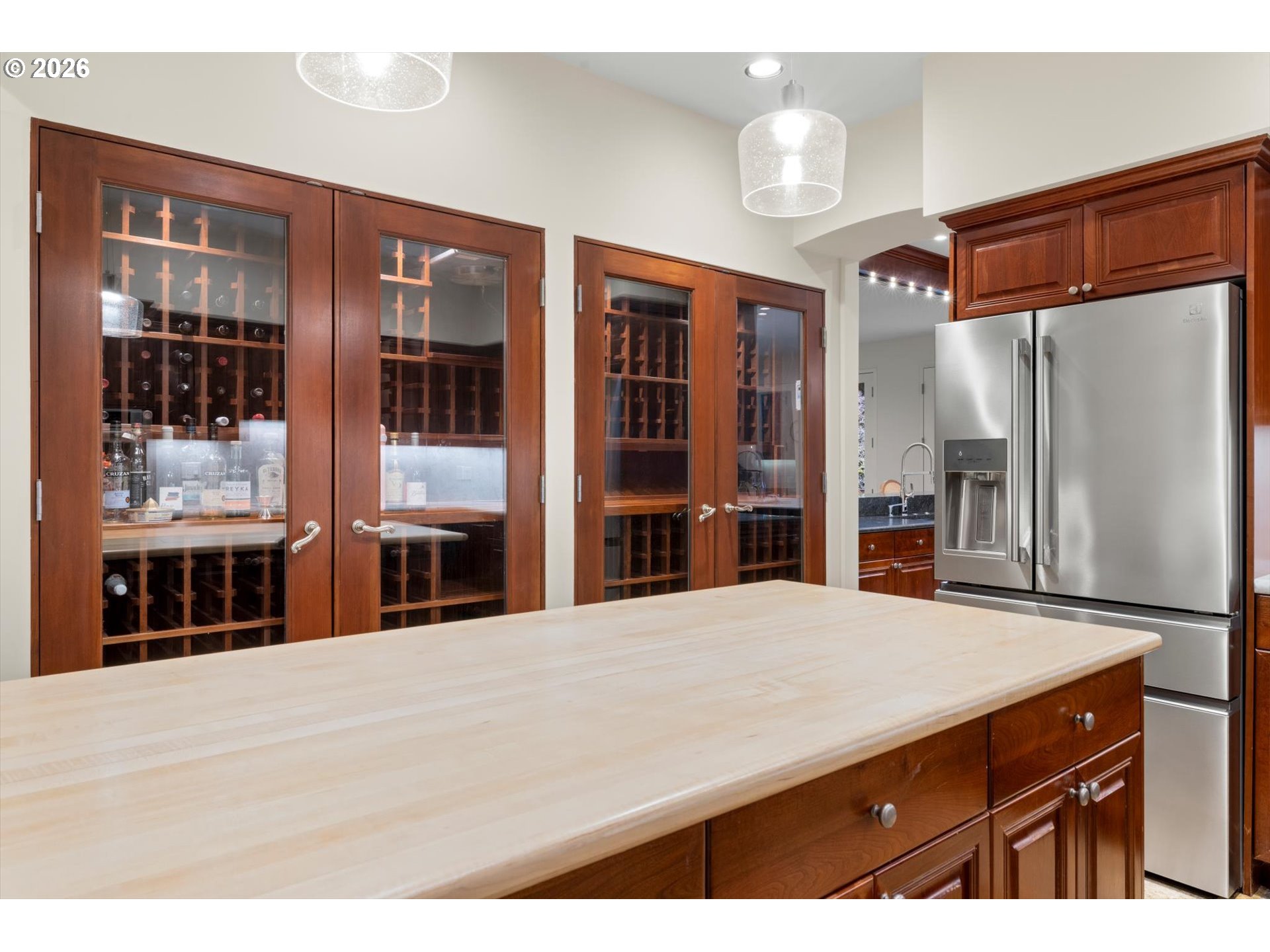 1616 South Greenwood Road Portland, OR 97219 - Photo 30 of 48 a kitchen view with stainless steel appliances kitchen island granite countertop a refrigerator and cabinets