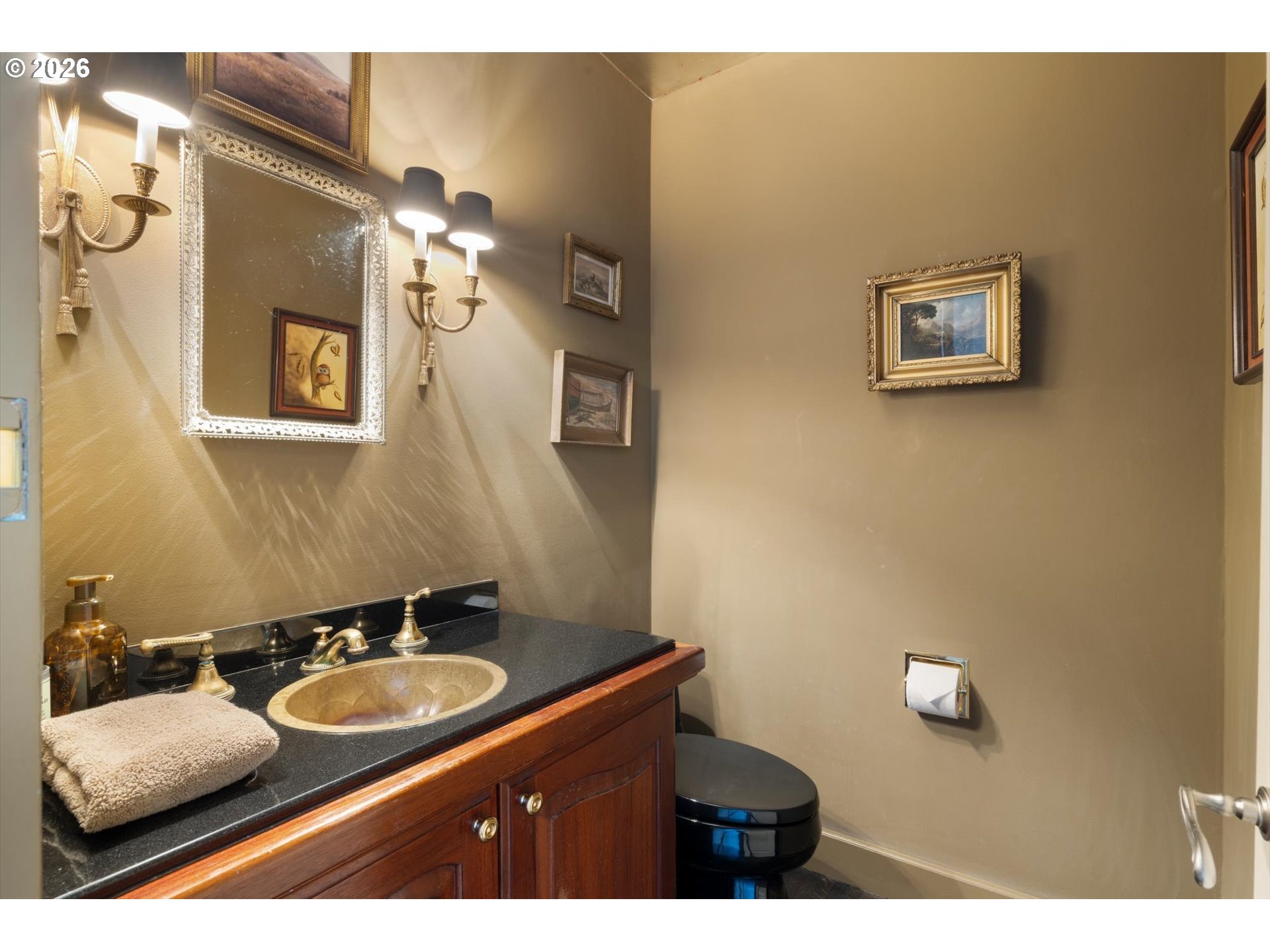 1616 South Greenwood Road Portland, OR 97219 - Photo 33 of 48 a bathroom with a sink and mirror