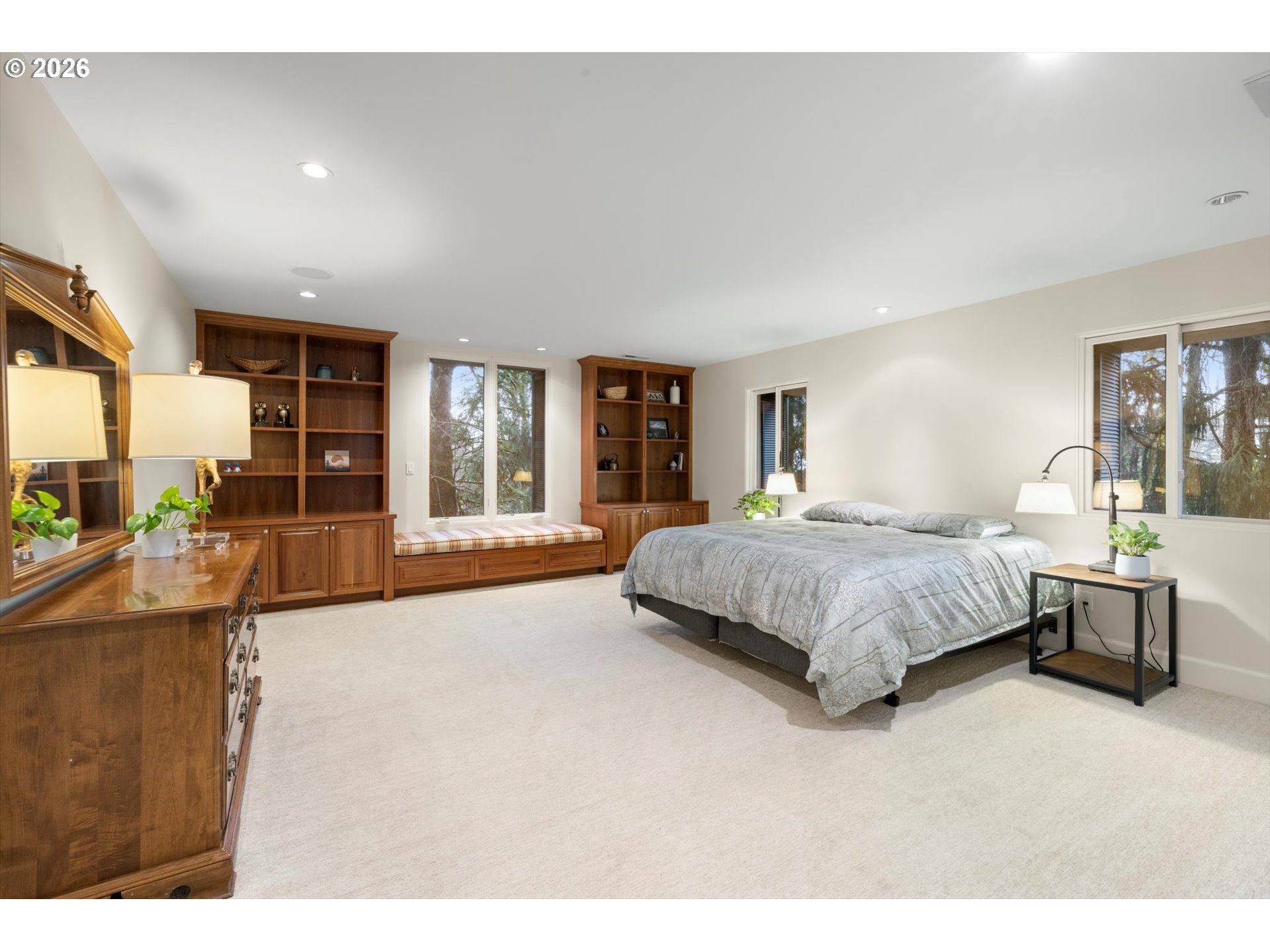1616 South Greenwood Road Portland, OR 97219 - Photo 38 of 48 a spacious bedroom with a large bed and a large window