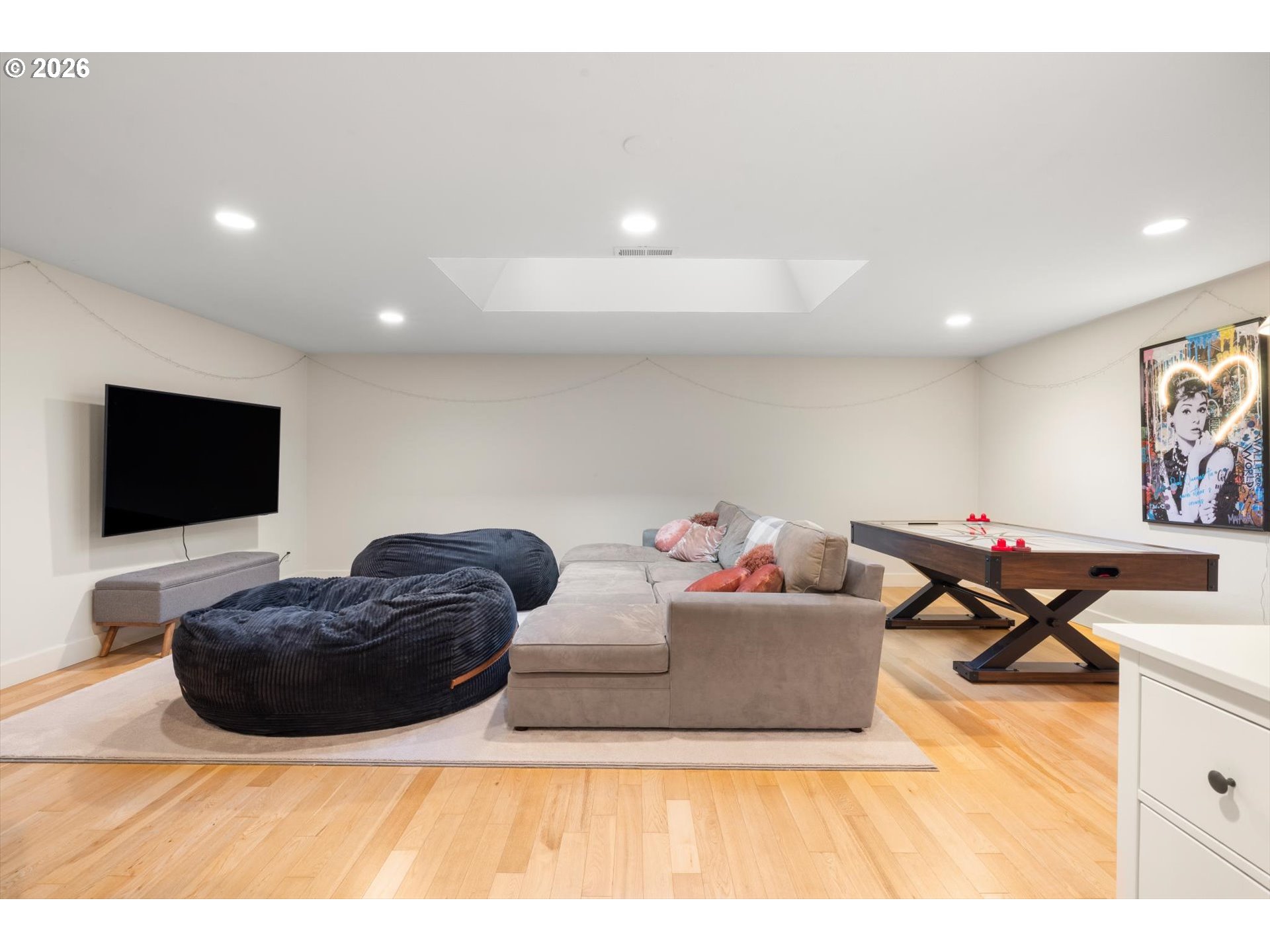 1616 South Greenwood Road Portland, OR 97219 - Photo 43 of 48 a living room with furniture and a flat screen tv