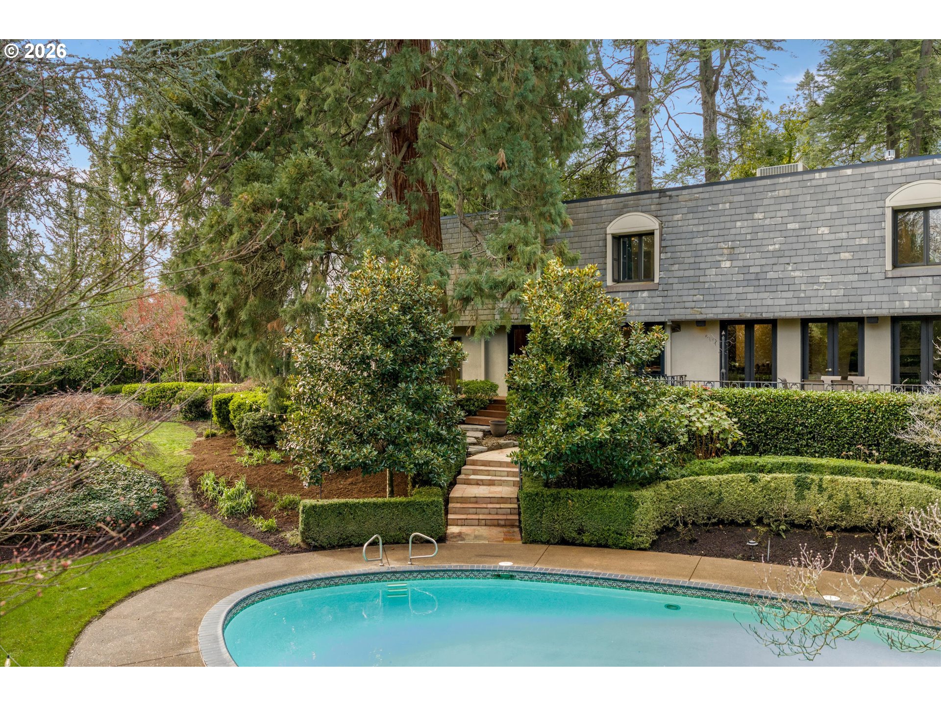 1616 South Greenwood Road Portland, OR 97219 - Photo 44 of 48 a view of a house with a yard