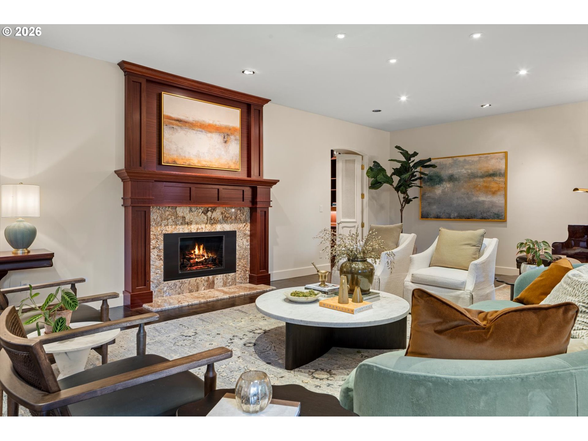 1616 South Greenwood Road Portland, OR 97219 - Photo 9 of 48 a living room with furniture a fireplace and a table