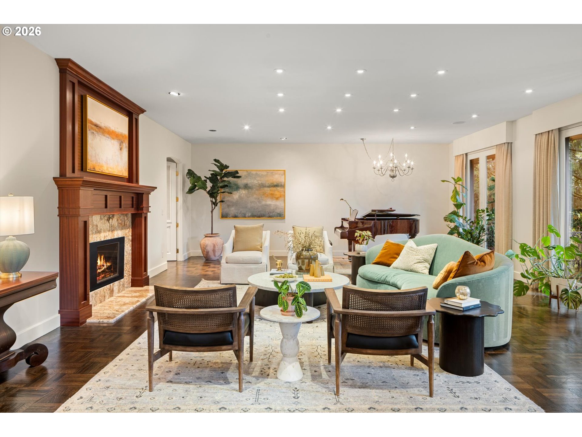 1616 South Greenwood Road Portland, OR 97219 - Photo 10 of 48 a living room with furniture a fireplace and a dining table with wooden floor