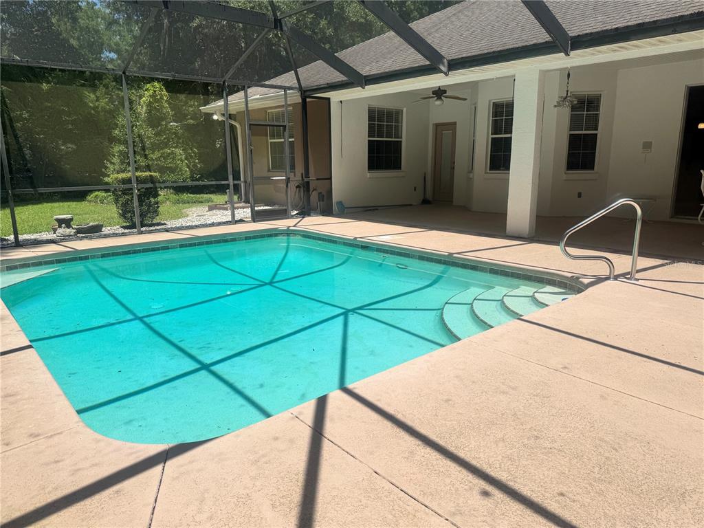 11145 Northwest 17th Court Road Ocala, FL 34475 - Photo 47 of 59 a house with view of swimming pool