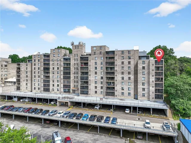 a view of building with balcony and seating space