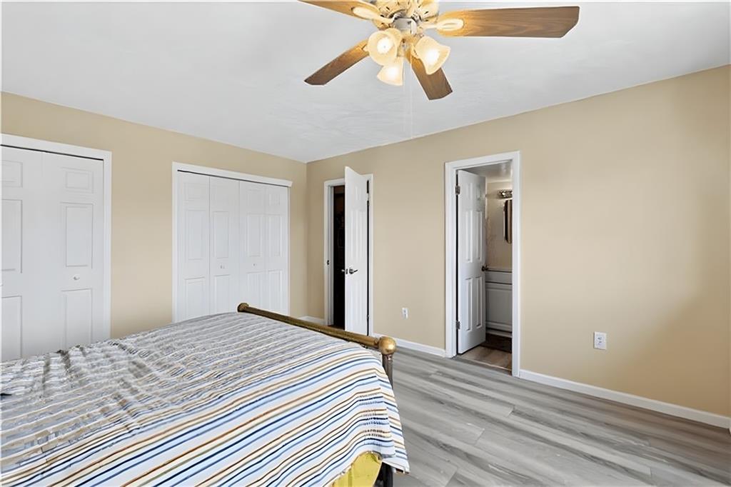 2120 Greentree Road, Unit 610E Pittsburgh, PA 15220 - Photo 12 of 23 a bedroom with a bed and a chandelier