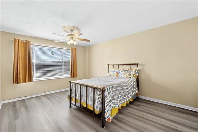 a bedroom with a bed and window