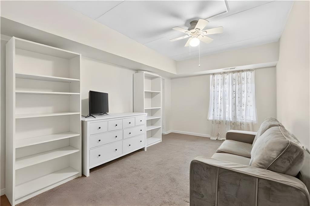 2120 Greentree Road, Unit 610E Pittsburgh, PA 15220 - Photo 14 of 23 a living room with furniture and a flat screen tv
