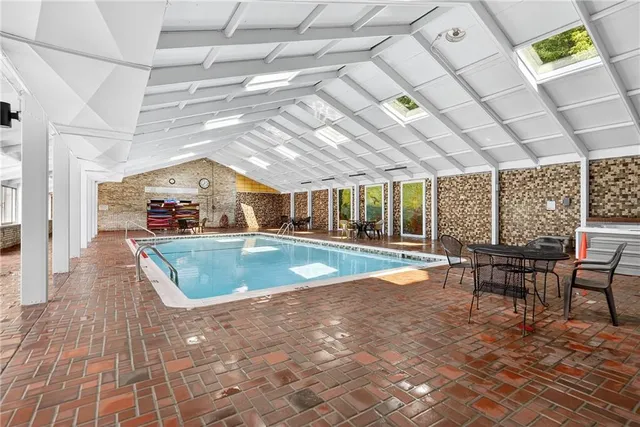 a view of a swimming pool with a patio