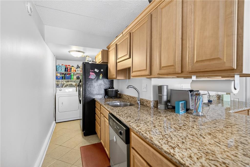 2120 Greentree Road, Unit 610E Pittsburgh, PA 15220 - Photo 6 of 23 a kitchen with stainless steel appliances granite countertop a sink stove and refrigerator
