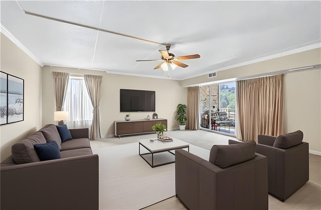 2120 Greentree Road, Unit 610E Pittsburgh, PA 15220 - Photo 8 of 23 a living room with furniture and a flat screen tv