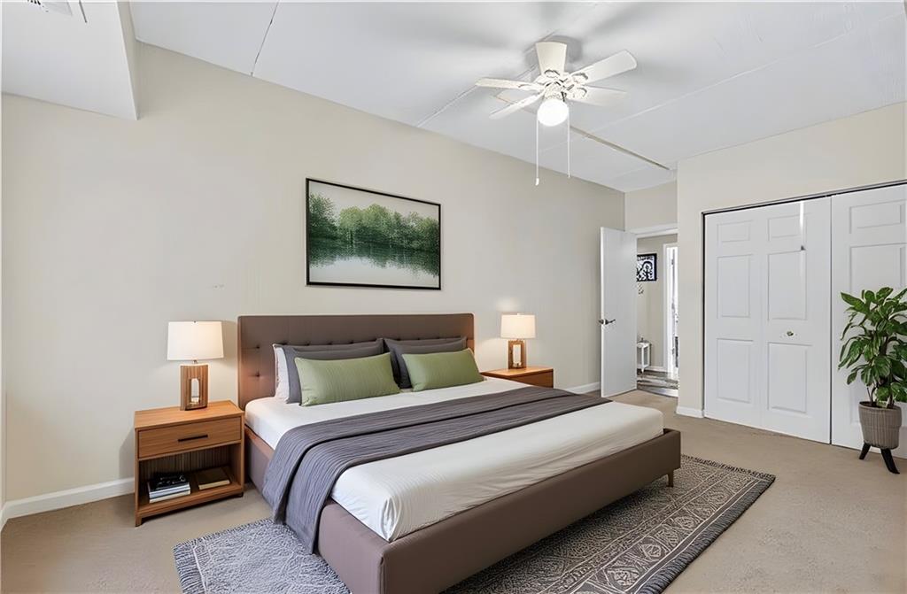 2120 Greentree Road, Unit 610E Pittsburgh, PA 15220 - Photo 10 of 23 a bedroom with bed and a chandelier