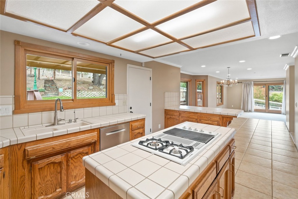 9170 Santa Lucia Road Atascadero, CA 93422 - Photo 13 of 60 a kitchen with a stove a sink dishwasher and a refrigerator