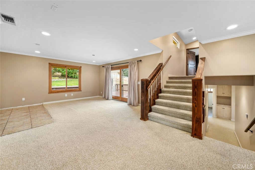 9170 Santa Lucia Road Atascadero, CA 93422 - Photo 16 of 60 a view of an empty room with a fireplace and a window