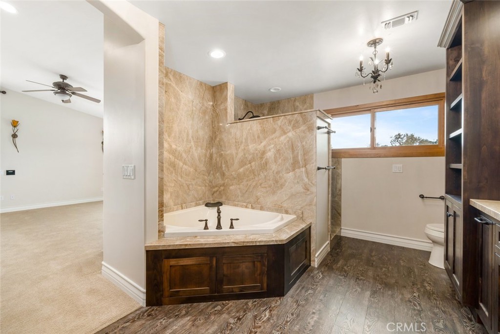 9170 Santa Lucia Road Atascadero, CA 93422 - Photo 24 of 60 a bathroom with a sink a shower and a mirror