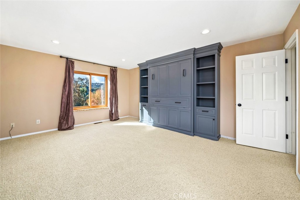 9170 Santa Lucia Road Atascadero, CA 93422 - Photo 29 of 60 an empty room with closet and wooden floor