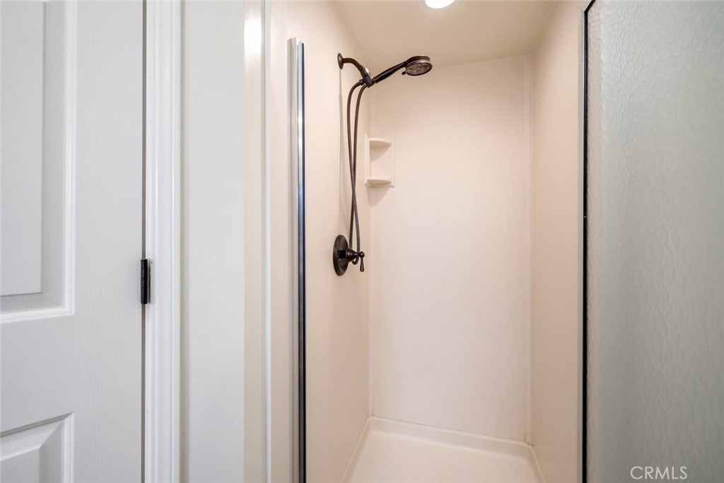 9170 Santa Lucia Road Atascadero, CA 93422 - Photo 36 of 60 a bathroom with a glass shower door