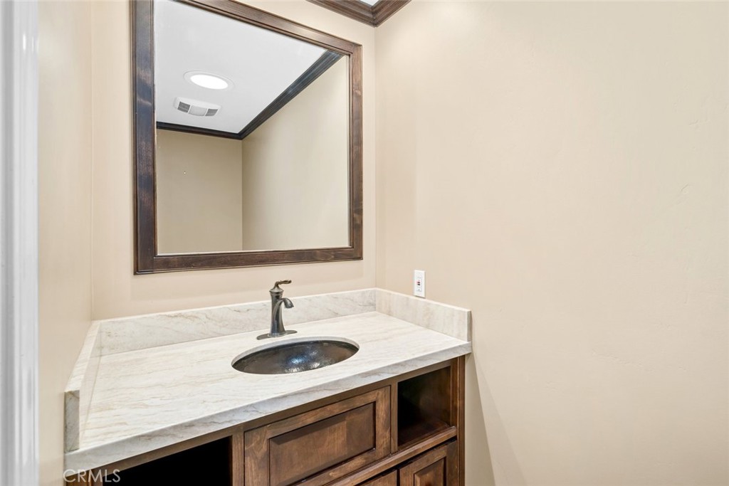 9170 Santa Lucia Road Atascadero, CA 93422 - Photo 39 of 60 a bathroom with a sink and a mirror
