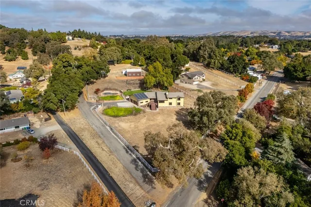 an aerial view of a house with a swimming pool