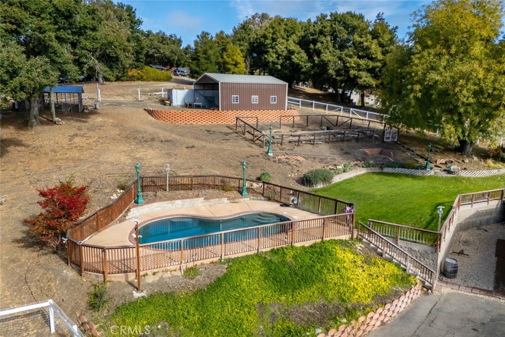 9170 Santa Lucia Road Atascadero, CA 93422 - Photo 57 of 60 a swimming pool with some potted plants and large trees