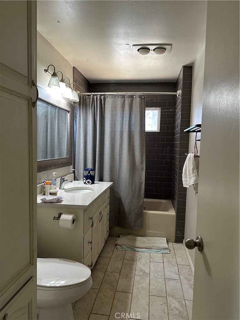 37380 Bohlen Road Anza, CA 92539 - Photo 4 of 10 a bathroom with a granite countertop sink toilet and shower