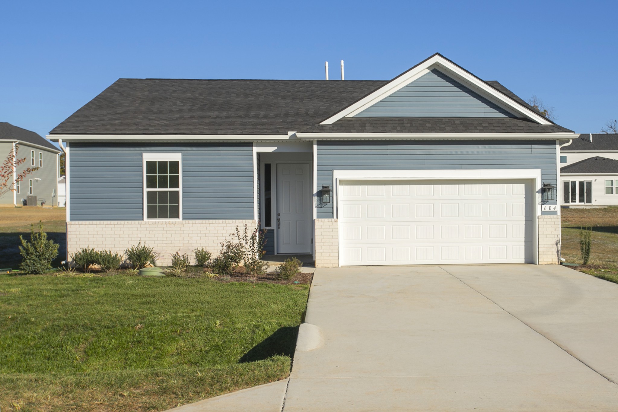 604 Maple Bend Dickson, TN 37055 - Photo 1 of 39 a front view of a house with a yard
